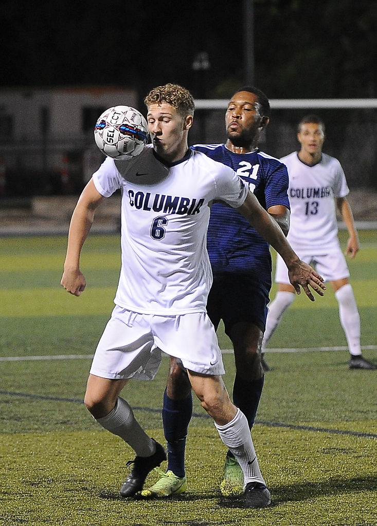 Columbia College junior Charles Norman settles the ball with an Oklahoma Wesleyan on his back on Friday